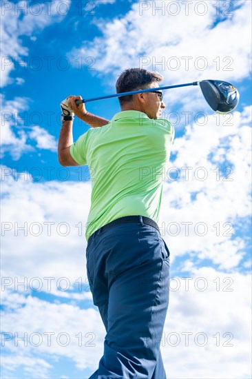 A player playing golf on the golf course