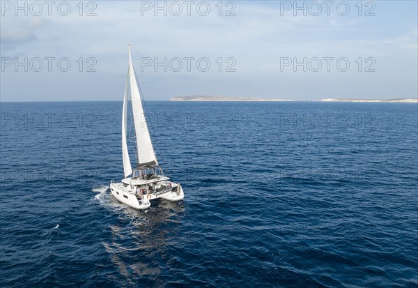 Sailing catamaran in full sail