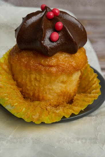 Assortment of chocolate and cream and carrot cupcakes on various backgrounds