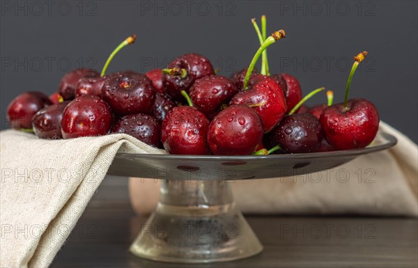 Fresh red summer cherries with water drops
