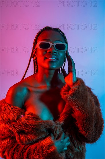 Attractive black ethnic woman with braids with red and blue led lights