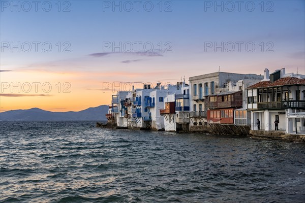 White Cycladic houses on the shore