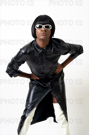 Black ethnic man in studio with white background