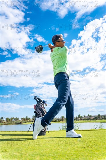 A player playing golf on the golf course