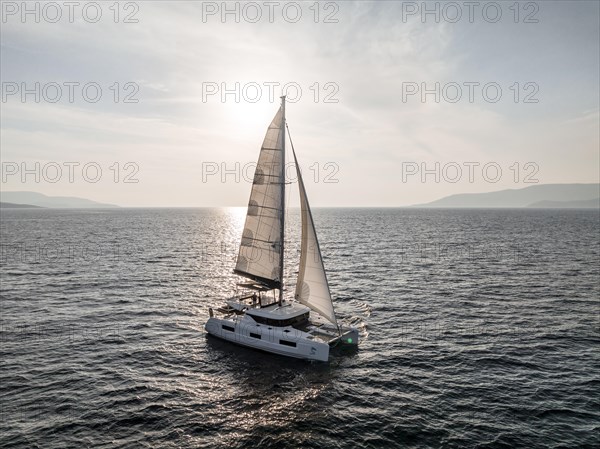 Sailing catamaran in full sail