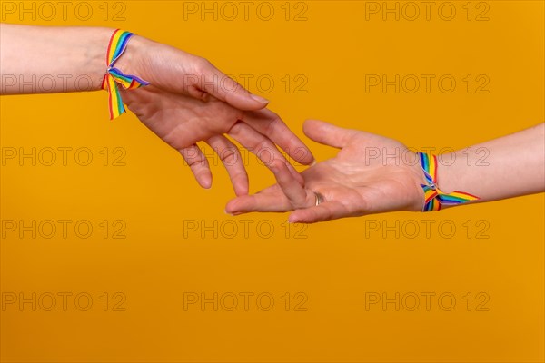 Hands of two women caressing and touching fingers