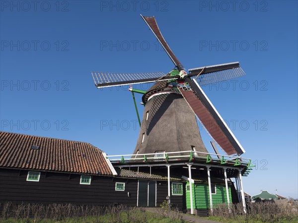 De Zoekern oil mill on the banks of the river Zaan in the Zaanse Schans museum village
