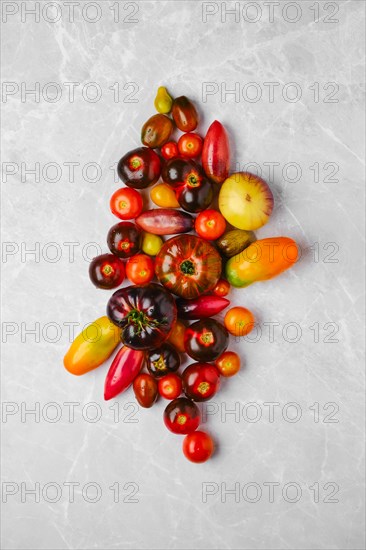 Vertical composition with various types of tomatoes