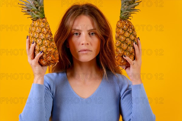 Woman with a pineapple in sunglasses