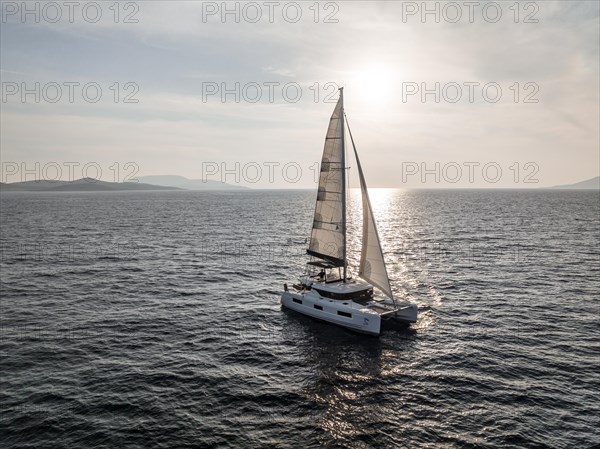 Sailing catamaran in full sail