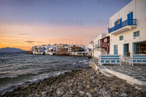 White Cycladic houses on the shore