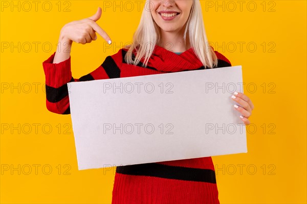 Pointing to an empty ad poster