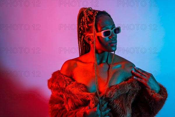 Attractive black ethnic woman with braids with red and blue led lights