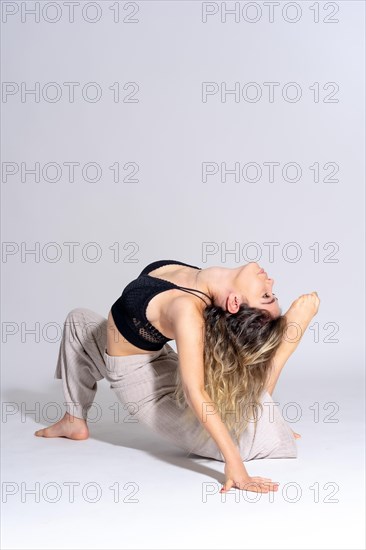 Young dancer in a studio photo session with a white background