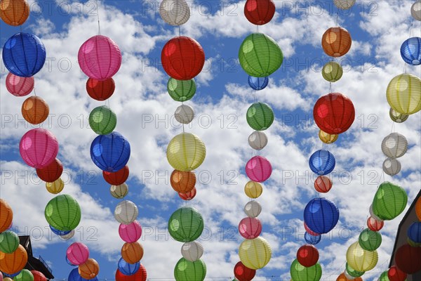 Colourful lanterns in the sky above the pedestrian zone