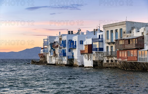 White Cycladic houses on the shore