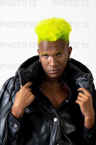 Black ethnic man in studio with white background