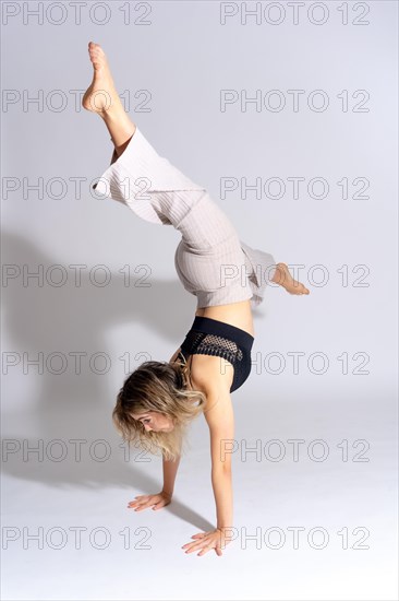 Young dancer in studio photo session with a white background