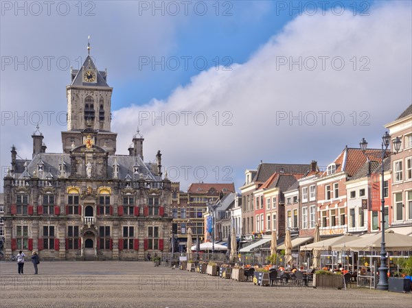 The beautiful Restored Town Hall Stadhuis Delft next to the traditional buildings on the Market Square