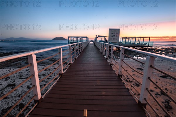 Long exposure at sunrise at the coast near Corralejo