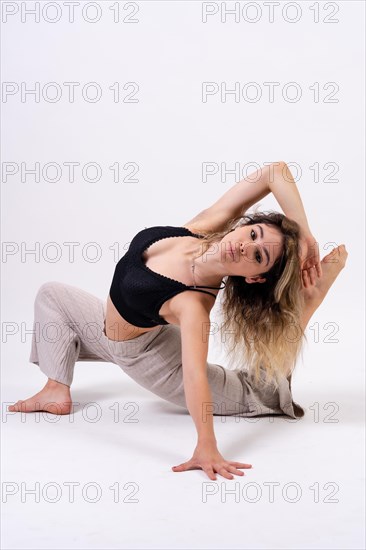 Young dancer in studio photo session with a white background