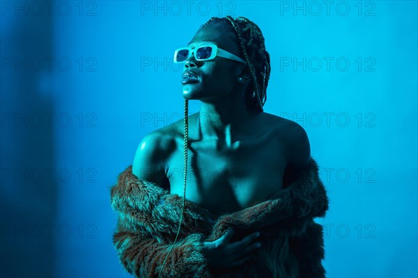 Attractive black ethnic woman with braids with blue led lights
