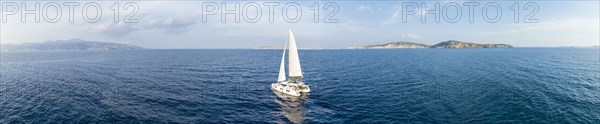 Sailing catamaran in full sail