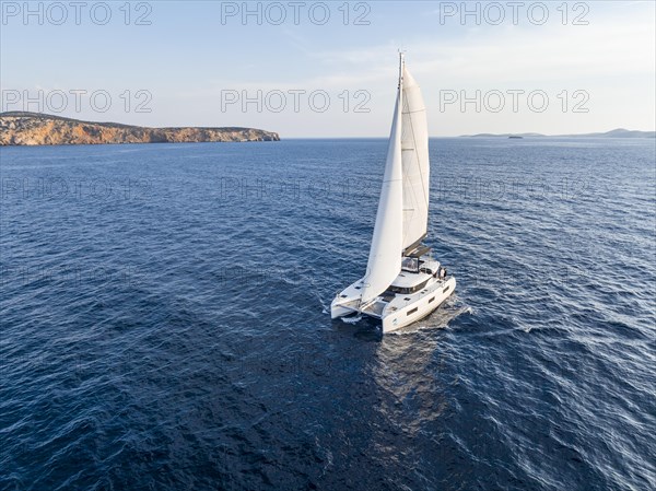 Sailing catamaran in full sail