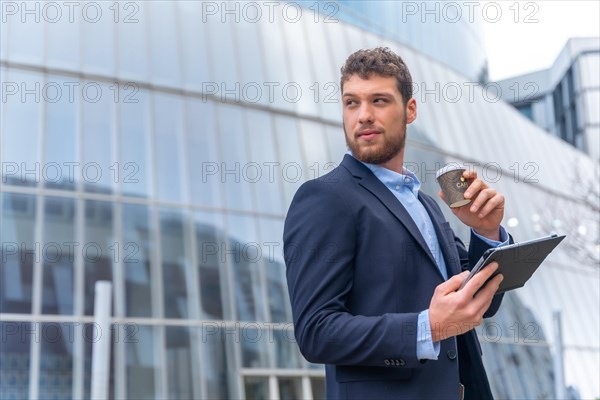 Young businessman man outside the office