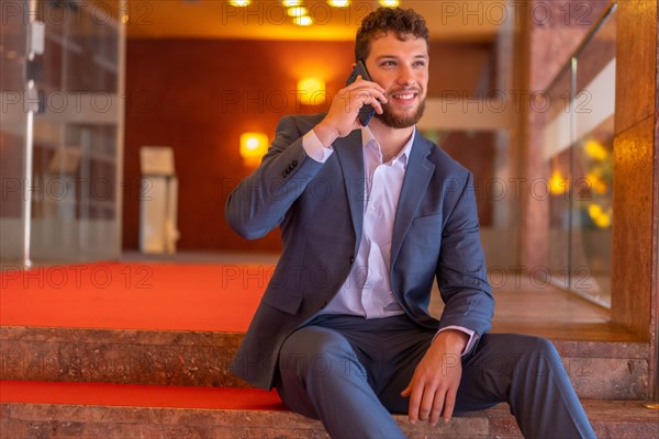 Portrait Male businessman or finance going down the stairs of the offices where he is the CEO of the company