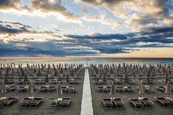 Empty beach and beach loungers