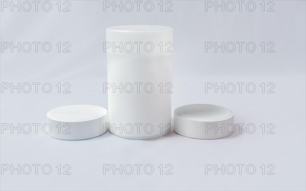 Swimming pool cleaning and maintenance chlorine tablets. Chlorine tablets for pool cleaning on isolated background. Chlorine tablets for swimming pool disinfection on white background