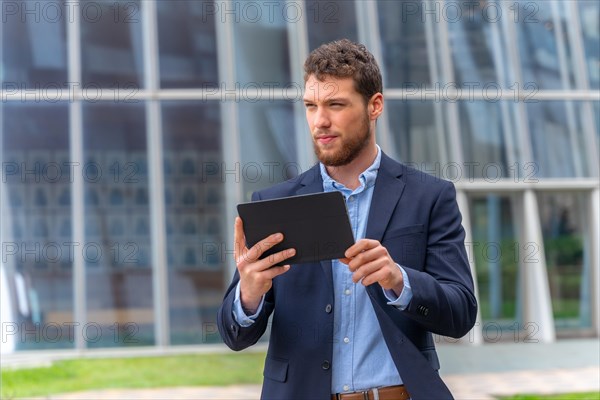 Young male businessman or entrepreneur outside the office