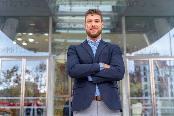 Portrait businessman CEO of a company at glass office entrance