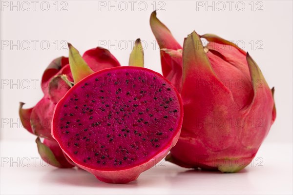 Pink pitahaya or dragon fruit isolated on white background with copy-space