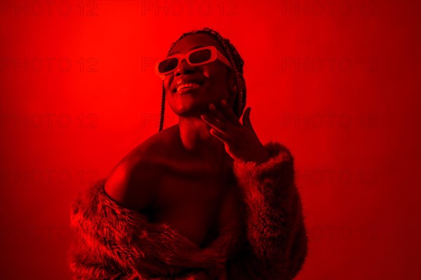 Attractive black ethnic woman with braids with red led lights