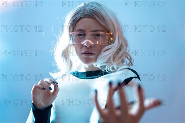 Woman with illuminated futuristic glasses and white hair