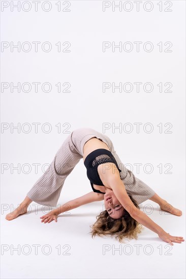 Young dancer in studio photo session with a white background