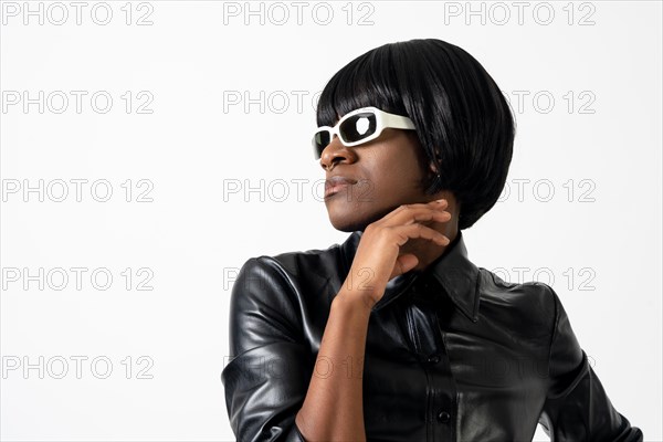 Black ethnic man in studio with white background