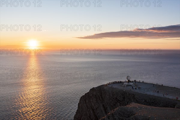 Steel globe at the North Cape under the midnight sun