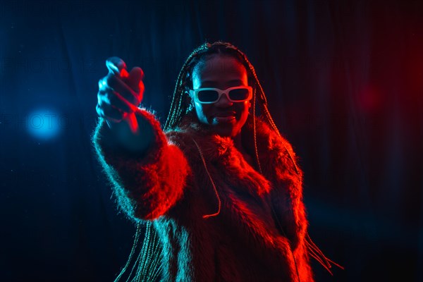 Young african woman with braids with blue and red led lights