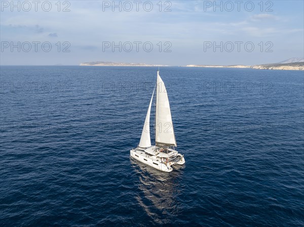 Sailing catamaran in full sail