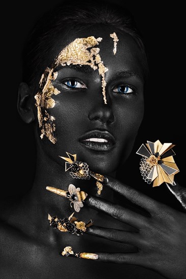 Beautiful woman with black art make-up