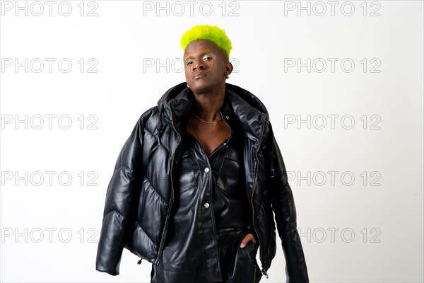 Black ethnic man in studio with white background