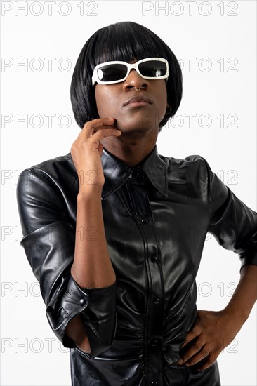 Black ethnic man in studio with white background