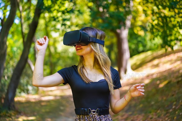 Woman with virtual reality glasses in nature