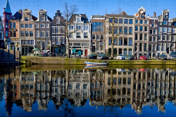 Historic merchant houses on the canal in the old town and with reflection in the water