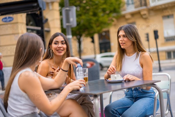 Friends enjoying an afternoon on a cafeteria terrace