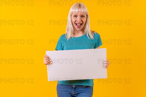 Holding white empty advertisement poster