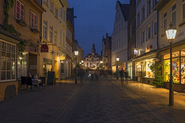 Evening lighting in the pedestrian zone with a view of the historic town hall